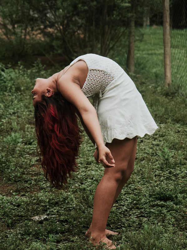 Person in a dynamic yet graceful movement, suggesting energy and flexibility.